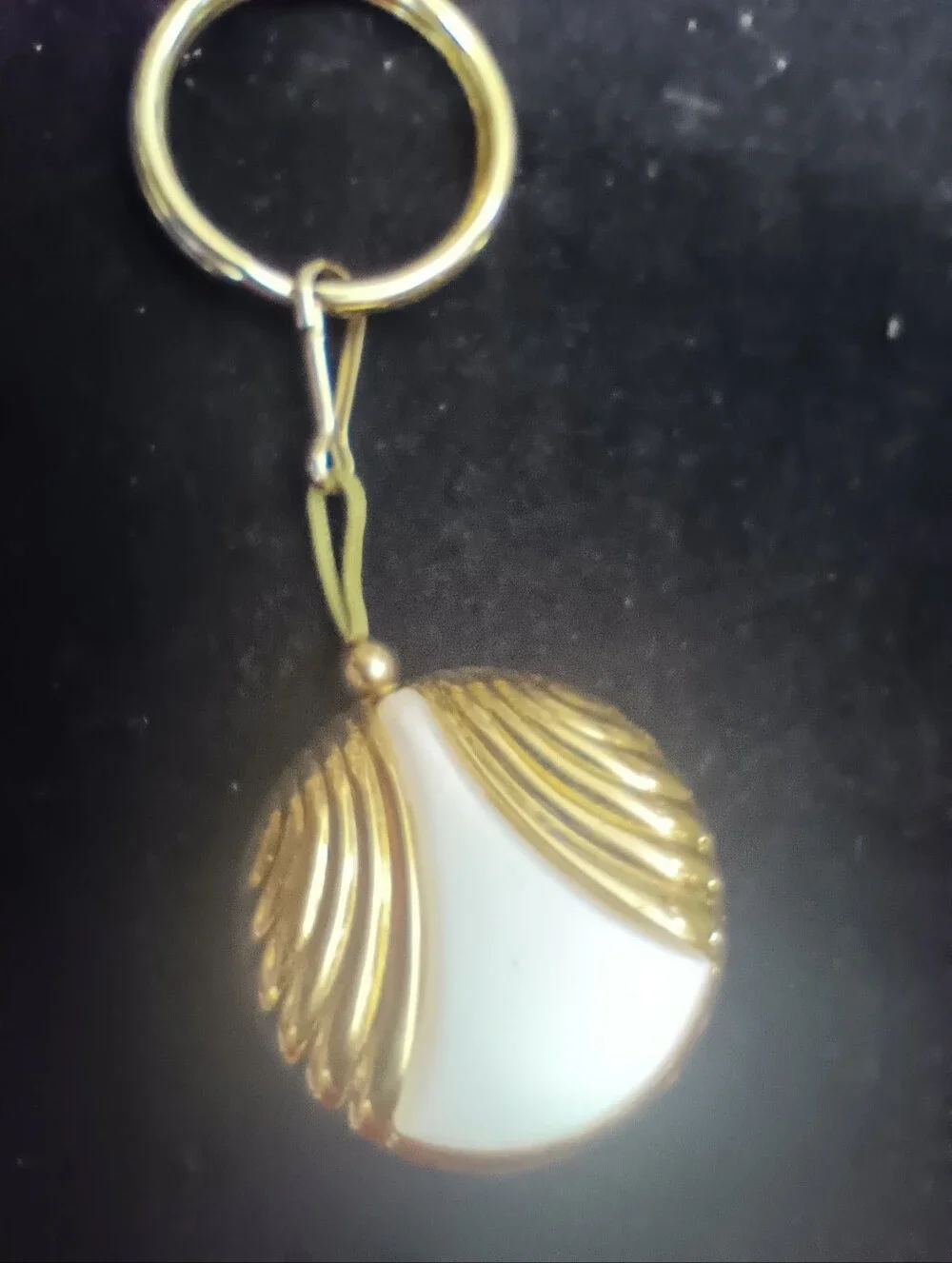 Vintage Avon Badge Reel. Gold Tone With Pearlesque Center